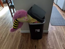 Size: 1249x937 | Tagged: safe, artist:qtpony, artist:tinyequine, derpibooru import, fluttershy, pegasus, pony, clothes, female, folded wings, into the trash it goes, irl, life size, mare, photo, plushie, ponies in real life, socks, solo, striped socks, trash can, wings, your waifu is trash