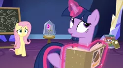 Size: 1598x898 | Tagged: safe, derpibooru import, screencap, fluttershy, twilight sparkle, twilight sparkle (alicorn), alicorn, pony, growing up is hard to do, book, chalkboard, duo, flower, glass case, levitation, magic, stack, table, telekinesis, twilight's castle, wishing flower