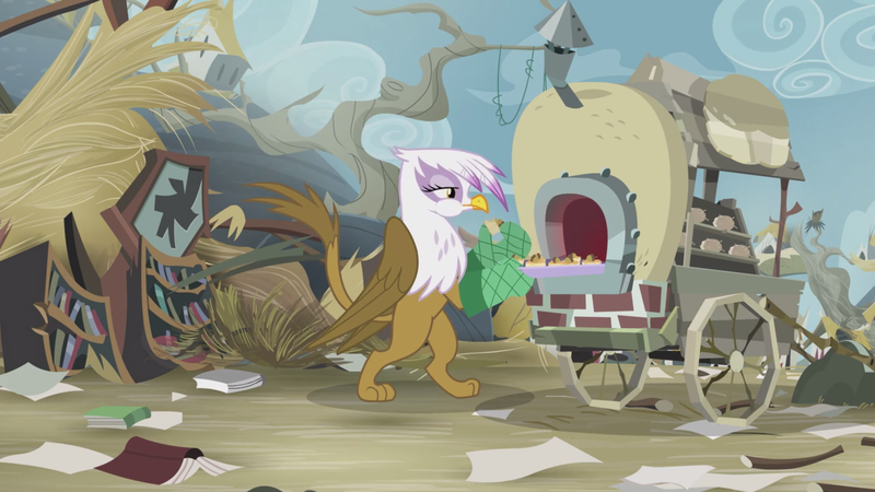 Size: 2100x1181 | Tagged: safe, derpibooru import, screencap, gilda, gryphon, the lost treasure of griffonstone, bipedal, book, bookshelf, cart, cooking, disrepair, eating, female, folded wings, griffon scone, griffonstone, library, lidded eyes, litter, oven mitts, paws, puffy cheeks, raised tail, scone, solo, tail, tasting, wings