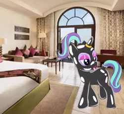 Size: 800x740 | Tagged: source needed, suggestive, artist:drunken bubblez, deleted from derpibooru, derpibooru import, starlight glimmer, pony, bdsm, bodysuit, bondage, female, gag, horn, horn ring, hotel, irl, latex, latex suit, magic suppression, mare, photo, ponies in real life, ring, ring gag, solo, tongue out