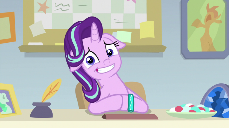 Size: 1920x1080 | Tagged: safe, derpibooru import, screencap, starlight glimmer, pony, unicorn, student counsel, awkward smile, bracelet, cute, female, floppy ears, food, geode, glimmerbetes, inkwell, jewelry, looking at you, mare, photo, quill, sitting, solo, starlight's office