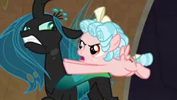 Size: 1280x720 | Tagged: safe, derpibooru import, screencap, cozy glow, queen chrysalis, changeling, pegasus, pony, frenemies (episode), angry, bags under eyes, bickering, bow, cozy glow is not amused, crown, curly hair, duo, evil lair, fangs, female, filly, flying, foal, former queen chrysalis, freckles, glare, grogar's lair, hair bow, insect wings, jewelry, lair, push, regalia, slit eyes, spread wings, tail bow, wings