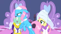 Size: 1136x640 | Tagged: safe, derpibooru import, screencap, aloe, fluttershy, lotus blossom, rarity, earth pony, pegasus, pony, unicorn, green isn't your color, applying, bathrobe, clothes, female, floppy ears, mare, mud mask, open mouth, robe, smiling, spa, towel on head