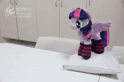 Size: 540x359 | Tagged: safe, artist:nekokevin, derpibooru import, twilight sparkle, twilight sparkle (alicorn), alicorn, pony, 4de, animated, clothes, cute, dancing, excited, female, gif, happy, irl, mare, open mouth, photo, pillow, plushie, smiling, socks, solo, spread wings, starlight's little twibird, stop motion, striped socks, table, twiabetes, wings