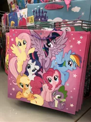 Size: 3024x4032 | Tagged: safe, derpibooru import, photographer:undeadponysoldier, applejack, fluttershy, pinkie pie, rainbow dash, rarity, spike, twilight sparkle, twilight sparkle (alicorn), alicorn, dragon, earth pony, pegasus, pony, unicorn, female, gift bag, male, mane seven, mane six, mare, price tag, walmart