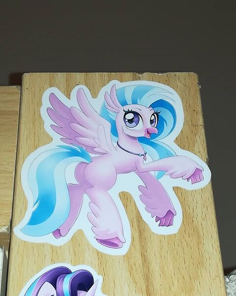 Size: 750x937 | Tagged: safe, derpibooru import, silverstream, starlight glimmer, hippogriff, pony, female, mare, smiling, solo focus, sticker, wood