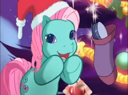 Size: 774x577 | Tagged: safe, derpibooru import, screencap, minty, pony, a very minty christmas, christmas, christmas tree, cute, g3, g3betes, hat, holiday, mane brush, mintabetes, ornament, santa hat, smiling, sock, tree, weapons-grade cute