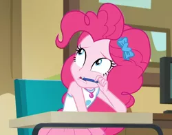 Size: 1194x934 | Tagged: safe, derpibooru import, screencap, pinkie pie, equestria girls, equestria girls series, holidays unwrapped, spoiler:eqg series (season 2), anxious, blizzard or bust, canterlot high, chair, classroom, cropped, cute, desk, diapinkes, female, geode of sugar bombs, magical geodes, pen, pen in mouth, solo, worried