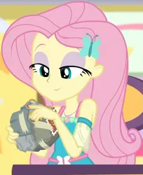 Size: 627x768 | Tagged: safe, derpibooru import, screencap, fluttershy, equestria girls, equestria girls series, holidays unwrapped, spoiler:eqg series (season 2), bad gift wrapping, burger, canterlot mall, chair, clothes, cropped, cute, dashing through the mall, dress, eyeshadow, flower, food, geode of fauna, gift giving, gift wrapped, hairclip, jewelry, lidded eyes, looking down, magical geodes, makeup, mall, necklace, present, shyabetes, sitting, smiling, stamp, table, waistband