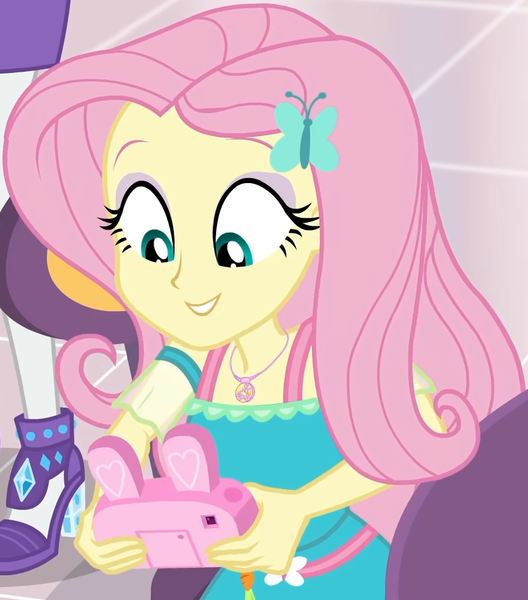 Size: 853x970 | Tagged: safe, derpibooru import, screencap, fluttershy, rarity, equestria girls, equestria girls series, holidays unwrapped, spoiler:eqg series (season 2), bunny ears, camera, canterlot mall, chair, clothes, cropped, cute, dashing through the mall, dress, female, flower, geode of fauna, gift giving, hairclip, happy, jewelry, looking down, magical geodes, mall, necklace, shyabetes, sitting, smiling, table, waistband