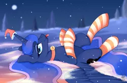 Size: 3028x1980 | Tagged: safe, artist:shadowreindeer, derpibooru import, princess luna, alicorn, pony, :p, bell, bell collar, christmas, clothes, collar, cute, female, hat, holiday, looking at you, lunabetes, mare, night, on back, profile, santa hat, silluna, snow, socks, solo, striped socks, tongue out