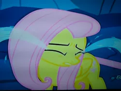 Size: 4160x3120 | Tagged: safe, derpibooru import, screencap, fluttershy, changeling, pegasus, pony, to where and back again, closed wing, cropped, crying, discovery family logo, disguise, disguised changeling, eyes closed, feelings, frown, hurt/comfort, hurting, looking away, ocular gushers, photo, picture of a screen, sad, solo, stuck