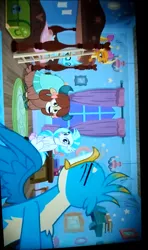 Size: 720x1219 | Tagged: safe, derpibooru import, screencap, gallus, ocellus, silverstream, smolder, yona, changedling, changeling, classical hippogriff, dragon, gryphon, hippogriff, yak, school raze, beak, bedroom, bow, closed mouth, cloven hooves, colored hooves, dragoness, eyes closed, female, grinding, hair bow, jewelry, looking at someone, looking back, male, monkey swings, necklace, open beak, open mouth, photo, picture of a screen, pulling, shocked, shocked expression, sideways image, sitting, sitting on bed, sitting on floor, smolder is not amused, spread wings, struggling, teeth grinding, unamused, video at source, wings