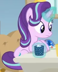 Size: 344x421 | Tagged: safe, derpibooru import, screencap, starlight glimmer, pony, unicorn, marks for effort, chocolate, cropped, desk, empathy cocoa, food, glow, glowing cup, glowing horn, hooves on the table, horn, hot chocolate, looking at someone, marshmallows, sitting, solo, starlight's office