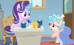Size: 858x521 | Tagged: safe, derpibooru import, screencap, cozy glow, starlight glimmer, pegasus, pony, unicorn, marks for effort, blanket, chocolate, covered, desk, duo, empathy cocoa, food, glow, glowing cup, glowing horn, hoof hold, hooves on the table, horn, hot chocolate, looking at each other, looking at someone, marshmallows, open mouth, sitting, starlight's office