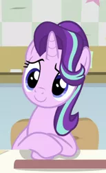 Size: 516x838 | Tagged: safe, derpibooru import, screencap, starlight glimmer, pony, unicorn, a horse shoe-in, cropped, cute, desk, female, glimmerbetes, mare, sitting, smiling, solo