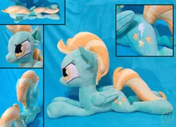 Size: 1024x741 | Tagged: safe, artist:whirlwindflux, derpibooru import, lightning dust, pegasus, pony, female, folded wings, irl, mare, photo, plushie, prone, solo, wings