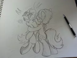 Size: 816x612 | Tagged: safe, artist:lucas_gaxiola, derpibooru import, oc, oc:charmed clover, earth pony, pony, unicorn, bipedal, black and white, blushing, gay, grayscale, hug, irl, male, monochrome, pencil, photo, stallion, traditional art