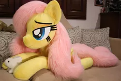 Size: 1024x683 | Tagged: safe, artist:ponimalion, derpibooru import, fluttershy, pony, bed, life size, pet, plushie