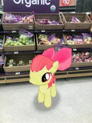 Size: 3024x4032 | Tagged: safe, derpibooru import, photographer:undeadponysoldier, apple bloom, earth pony, pony, apple, bow, female, filly, food, fruit, grocery store, in character, irl, photo, ponies in real life, solo, walmart