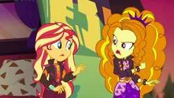 Size: 1920x1080 | Tagged: safe, derpibooru import, screencap, adagio dazzle, sunset shimmer, equestria girls, equestria girls series, sunset's backstage pass!, spoiler:eqg series (season 2), bracelet, clothes, geode of empathy, jacket, jewelry, leather jacket, magical geodes, music festival outfit, shorts, spiked wristband, wristband