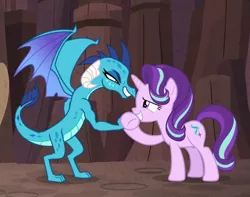 Size: 1123x886 | Tagged: safe, derpibooru import, screencap, princess ember, starlight glimmer, dragon, pony, unicorn, celestial advice, cropped, dragoness, duo, female, handshake, holding hands, looking at each other, mare, muscles, predator (franchise), smiling