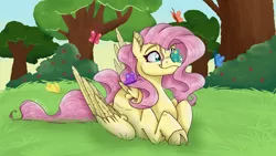 Size: 5600x3150 | Tagged: safe, artist:feathershine1, derpibooru import, fluttershy, butterfly, pegasus, pony, butterfly on nose, cloven hooves, cross-eyed, cute, ear fluff, female, folded wings, grass, high res, insect on nose, looking at something, mare, outdoors, prone, shyabetes, smiling, solo, stray strand, tree, wings
