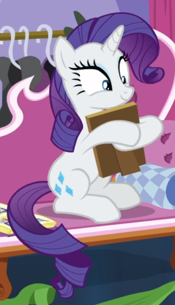 Size: 404x702 | Tagged: safe, derpibooru import, screencap, rarity, pony, unicorn, forever filly, book, cropped, fainting couch, female, holding, mare, photo album, picture frame, sitting, smiling, solo