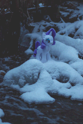 Size: 600x900 | Tagged: safe, artist:synch-anon, derpibooru import, rarity, unicorn, animated, irl, photo, plushie, snow, snowfall, solo, water, waterfall