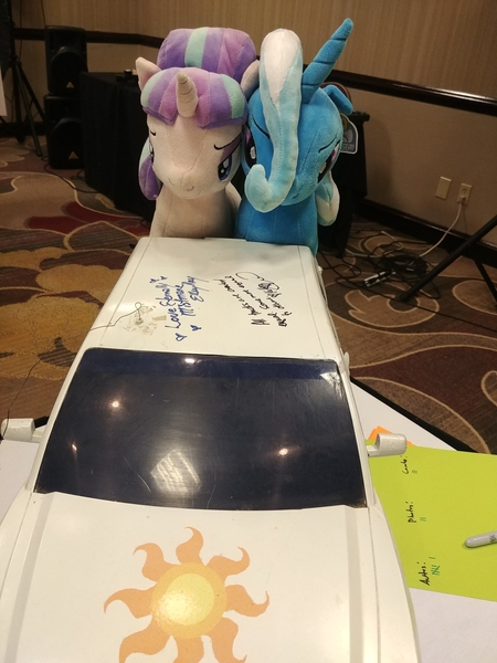 Size: 1560x2080 | Tagged: autograph, cutie mark, derpibooru import, harmonycon 2020, irl, kelly sheridan, meta, photo, pickup truck, plushie, princess celestia, radio control, safe, starlight glimmer, trixie, twitter