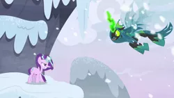 Size: 1280x720 | Tagged: safe, derpibooru import, screencap, queen chrysalis, starlight glimmer, changeling, unicorn, the ending of the end, angry, badass, charging, duo, duo female, fangs, female, fight, flying, forked tongue, glowing horn, gritted teeth, hissing, horn, magic, mountain, open mouth, outdoors, snow, snowfall, tongue out, ultimate chrysalis, wind, windswept mane, wings