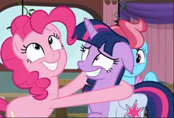 Size: 1212x823 | Tagged: safe, derpibooru import, screencap, cup cake, pinkie pie, twilight sparkle, twilight sparkle (alicorn), alicorn, earth pony, pony, a trivial pursuit, bag, cropped, cute, diapinkes, duo focus, excited, faic, fake smile, female, floppy ears, grin, hug, looking up, mare, nervous, nervous grin, saddle bag, smiling, team twipie