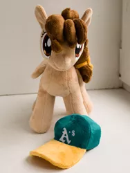 Size: 1650x2200 | Tagged: safe, artist:valmiiki, derpibooru import, oc, oc:vanilla creame, unofficial characters only, pegasus, pony, baseball cap, cap, cute, female, folded wings, front view, hat, irl, mare, oakland athletics, photo, plushie, simple background, solo, wings