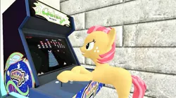 Size: 1024x575 | Tagged: safe, artist:undeadponysoldier, derpibooru import, babs seed, earth pony, pony, 3d, arcade, arcade game, competitive, female, filly, galaga, gaming, gm construct, gmod, playing video games, smiling