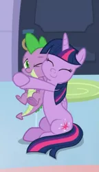 Size: 393x680 | Tagged: safe, derpibooru import, screencap, spike, twilight sparkle, twilight sparkle (alicorn), alicorn, dragon, the ending of the end, cropped, cute, duo, eyes closed, hug, sitting, spikabetes, twiabetes, winged spike