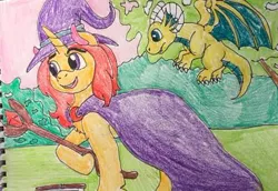Size: 400x275 | Tagged: safe, artist:wolfspiritclan, derpibooru import, oc, oc:redmoon, dragon, pony, unicorn, ponyfinder, baby, baby dragon, book, cloak, clothes, dungeons and dragons, female, hat, mage, mare, pen and paper rpg, rpg, spellbook, traditional art, witch, wizard, wizard hat, wizard staff