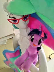 Size: 768x1024 | Tagged: safe, artist:nekokevin, derpibooru import, princess celestia, twilight sparkle, alicorn, pony, unicorn, chair, clothes, duo, female, glasses, irl, lidded eyes, looking at you, mare, open mouth, photo, plushie, shirt, sitting, size difference, smiling, teacher and student, unicorn twilight