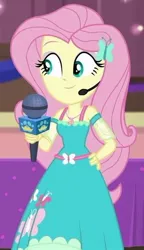 Size: 338x587 | Tagged: safe, derpibooru import, screencap, fluttershy, best in show: the victory lap, equestria girls, equestria girls series, spoiler:eqg series (season 2), cropped, cute, hand on hip, microphone, shyabetes, smiling, solo