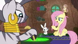 Size: 1920x1080 | Tagged: safe, derpibooru import, screencap, angel bunny, fluttershy, zecora, pegasus, pony, rabbit, zebra, she talks to angel, animal, cauldron, ear piercing, earring, female, jewelry, male, mare, messy mane, neck rings, piercing, sitting, zecora's hut