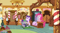 Size: 1600x900 | Tagged: book, cakes for the memories, candy, candy cane, ceiling light, chandelier, crossed hooves, derpibooru import, display case, door, dragon, food, indoors, looking up, pinkie pie, rug, safe, scrapbook, screencap, spike, spoiler:cakes for the memories, spoiler:mlp friendship is forever, starlight glimmer, sugarcube corner, vase, watermark, winged spike