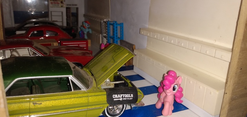 Size: 3264x1546 | Tagged: safe, artist:perpetualfanboy, derpibooru import, apple bloom, pinkie pie, rainbow dash, earth pony, pegasus, blind bag, car, chevrolet impala, door, everfree customs, ford crown victoria police interceptor, garage, pontiac gto, shelf, sink, toolbox, toy, volkswagen beetle, window, workbench