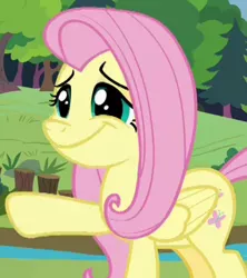 Size: 341x384 | Tagged: safe, derpibooru import, screencap, fluttershy, pegasus, pony, memnagerie, spoiler:memnagerie, spoiler:mlp friendship is forever, cropped, cute, faic, female, folded wings, mare, raised hoof, shyabetes, solo, wide smile, wings