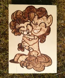 Size: 1943x2314 | Tagged: safe, artist:themisto97, derpibooru import, pinkie pie, earth pony, pony, my little pony: pony life, craft, cute, diapinkes, duo, g4, generational ponidox, grass, grin, hug, photo, pyrography, self ponidox, smiling, traditional art, wood