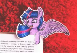 Size: 3705x2577 | Tagged: safe, artist:rysunkowasucharia, derpibooru import, twilight sparkle, twilight sparkle (alicorn), alicorn, pony, book, bookmark, colored pencil drawing, cute, cutout, female, high res, irl, mare, photo, polish, solo, spread wings, text, that pony sure does love books, the plague (novel), traditional art, twiabetes, wings