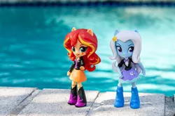 Size: 1400x933 | Tagged: safe, artist:aquilateagle, derpibooru import, sunset shimmer, trixie, equestria girls, doll, equestria girls minis, female, lesbian, photo, shipping, suntrix, swimming pool, toy