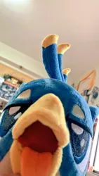 Size: 576x1024 | Tagged: safe, artist:nekokevin, derpibooru import, gallus, gryphon, beak, birb, close-up, cute, gallabetes, irl, lidded eyes, looking at you, male, maw, mawshot, open mouth, photo, plushie, solo, teenager, tongue out