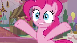 Size: 1280x720 | Tagged: safe, derpibooru import, screencap, pinkie pie, earth pony, memories and more, the last problem, spoiler:memories and more, spoiler:mlp friendship is forever, female, mare, raised hooves, smiling, solo, table, wide eyes