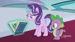 Size: 1280x720 | Tagged: safe, derpibooru import, screencap, spike, starlight glimmer, dragon, pony, unicorn, memories and more, spoiler:memories and more, spoiler:mlp friendship is forever, 9now, book, levitation, magic, magic aura, scrapbook, telekinesis, winged spike