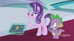 Size: 1280x720 | Tagged: safe, derpibooru import, screencap, spike, starlight glimmer, dragon, pony, unicorn, memories and more, spoiler:memories and more, spoiler:mlp friendship is forever, 9now, book, crossed arms, duo, levitation, magic, magic aura, scrapbook, telekinesis, winged spike