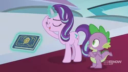 Size: 1280x720 | Tagged: safe, derpibooru import, screencap, spike, starlight glimmer, dragon, pony, unicorn, memories and more, spoiler:memories and more, spoiler:mlp friendship is forever, 9now, book, crossed arms, duo, eyes closed, levitation, magic, magic aura, scrapbook, telekinesis, winged spike